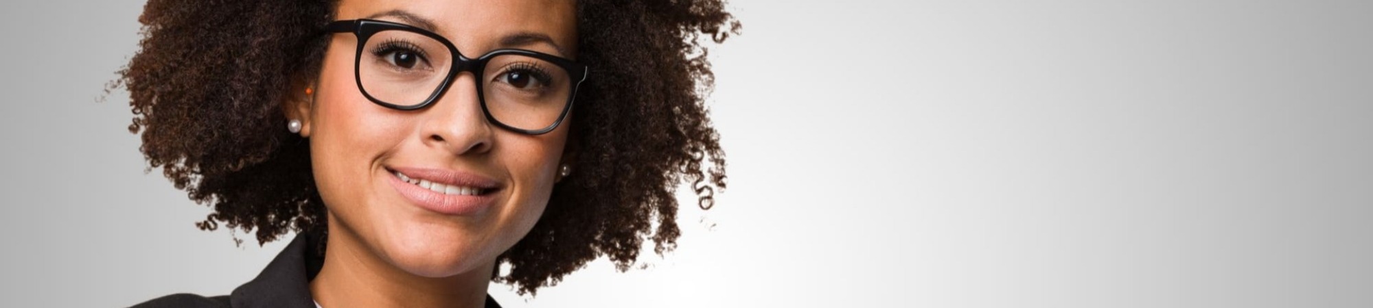 Businesswoman smiling and looking directly at the cameraound