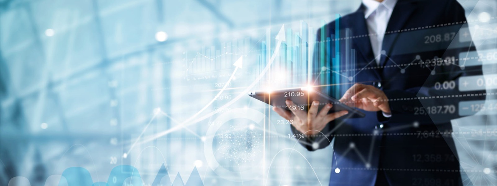 Businessman using tablet to analyze financial information and charts 